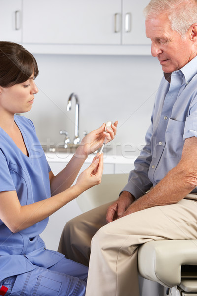 Doctor Giving Male Patient Injection Stock photo © monkey_business