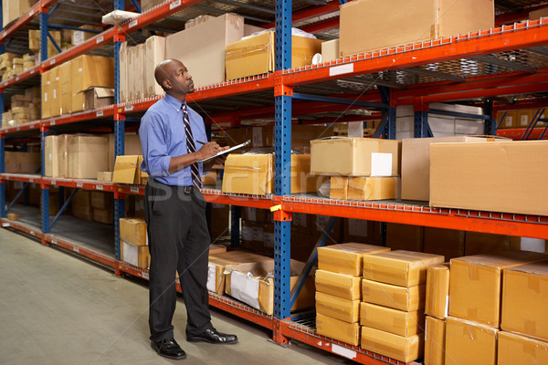 Businessman With Clipboard In Warehouse Stock photo © monkey_business