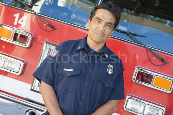 Retrato bombeiro carro de bombeiros cor em pé serviços Foto stock © monkey_business