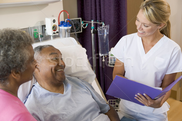 Medic notiţe pacient om femei Imagine de stoc © monkey_business
