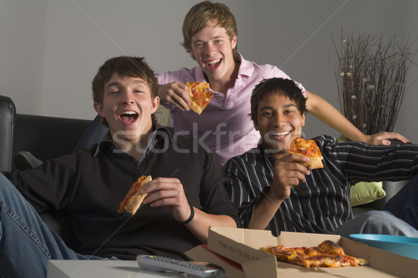 Foto stock: Adolescentes · alimentação · pizza · casa · grupo