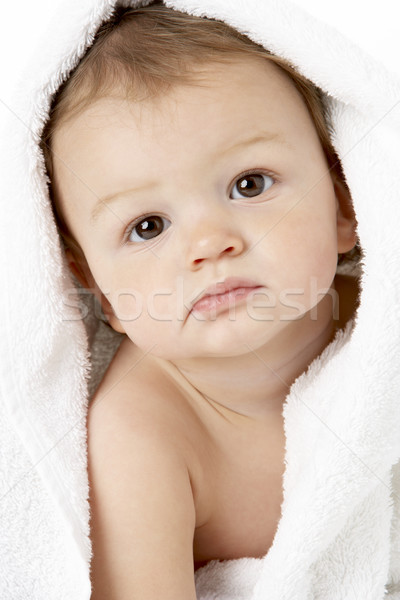Stock photo: Studio Portrait Of Baby Boy Wrapped In Towel