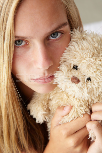 Unhappy teenage girl with cuddly toy Stock photo © monkey_business