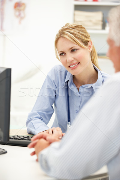 Young doctor with senior patient Stock photo © monkey_business