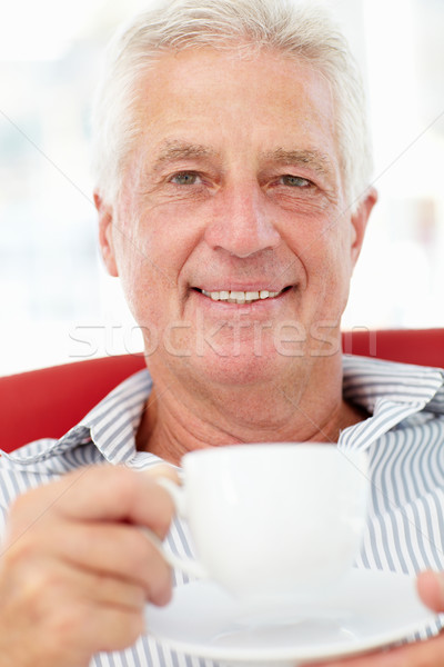 Senior man relaxing with cup of tea Stock photo © monkey_business