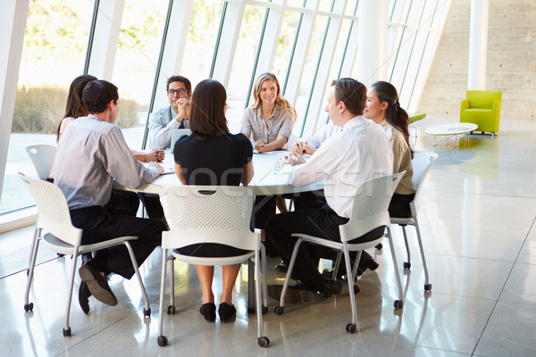 üzletemberek elnökségi ülés modern iroda üzlet férfi Stock fotó © monkey_business