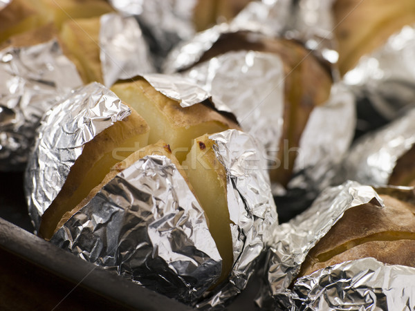 Tray of Jacket Potatoes Wrapped in Foil Stock photo © monkey_business