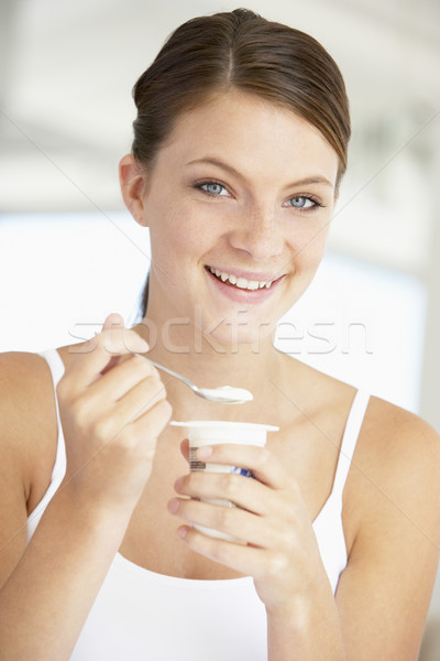 Fiatal nő eszik joghurt étel boldog személy Stock fotó © monkey_business