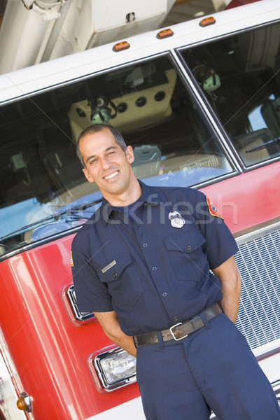 Portrait of a firefighter by a fire engine Stock photo © monkey_business