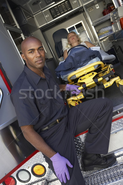 Male paramedic preparing to unload patient from ambulance Stock photo © monkey_business