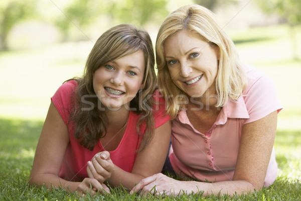 Woman Lying On The Ground With Her Teenage Daughter Stock photo © monkey_business