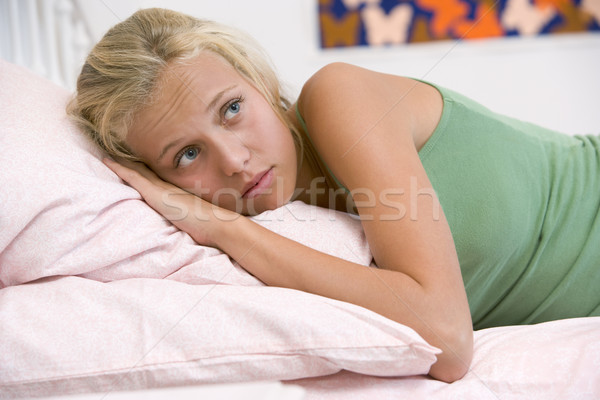 кровать девушки печально подушкой расслабляющая Сток-фото © monkey_business