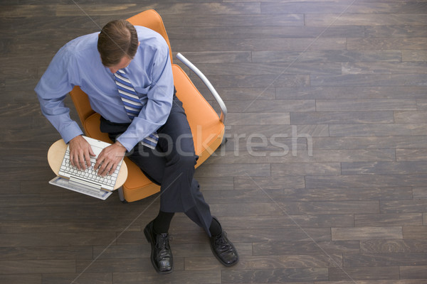 üzletember ül bent laptop férfi munka Stock fotó © monkey_business