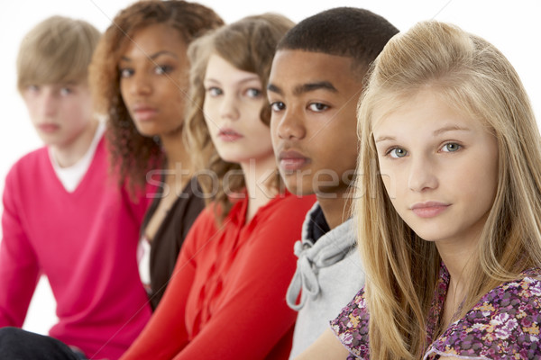 Studio Portrait Of Five Teenage Friends Standing In Line Stock photo © monkey_business