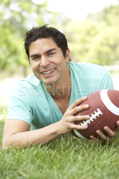 Stockfoto: Portret · jonge · man · park · amerikaanse · voetbal · man