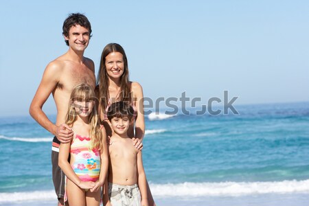 Mother And Daughter Relaxing Together On Beach Holiday Stock photo © monkey_business