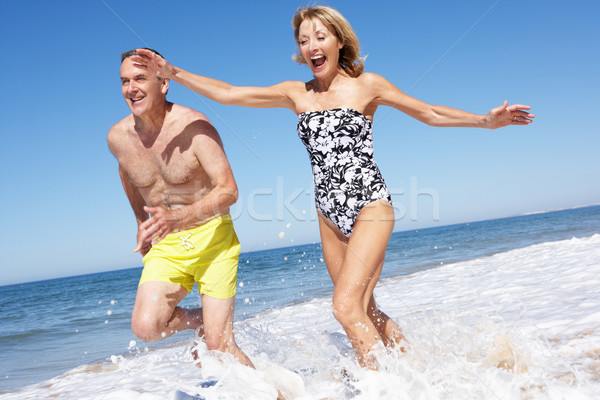 Senior Couple Enjoying Beach Holiday Stock photo © monkey_business