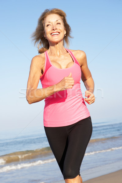 Idős nő testmozgás tengerpart nők tenger Stock fotó © monkey_business