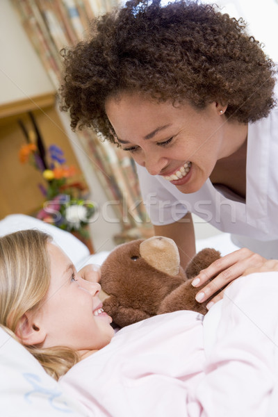 Verpleegkundige lachend jonge patiënt vrouw meisje Stockfoto © monkey_business