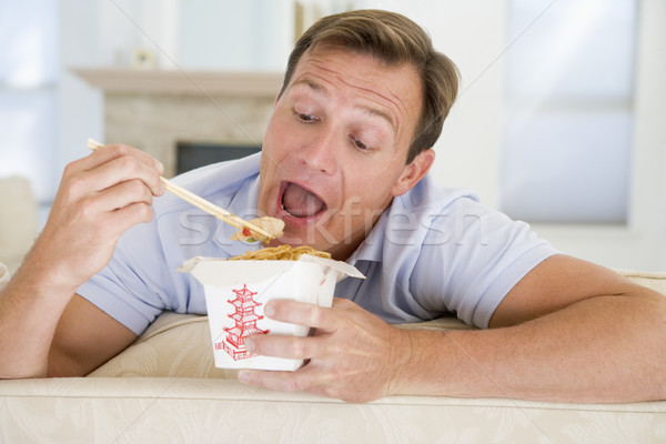 Man Eating Takeaways With Chopsticks  Stock photo © monkey_business