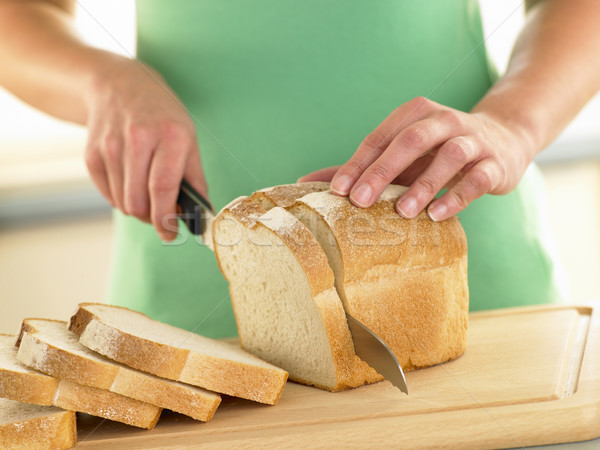 Nő szeletel cipó fehér kenyér étel kéz Stock fotó © monkey_business