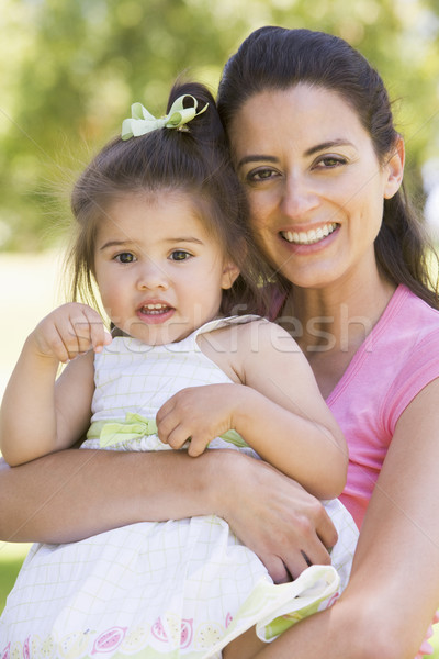 Anya tart lánygyermek kint mosolyog baba Stock fotó © monkey_business
