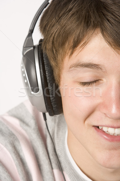 Teenage Boy Listening To Music On Headphones Stock photo © monkey_business