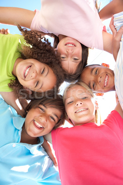 Csoport gyerekek lefelé néz kamera lány boldog Stock fotó © monkey_business