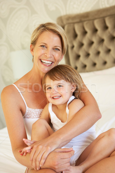 Mother And Daughter Relaxing In Bedroom Stock photo © monkey_business