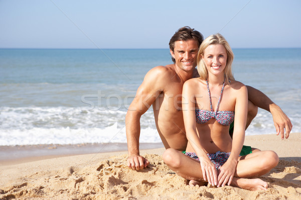 Young couple on beach holiday Stock photo © monkey_business