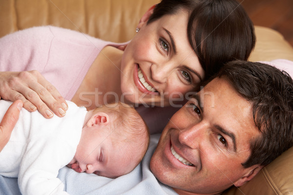 Portrait Of Proud Parents With Newborn Baby At Home Stock photo © monkey_business