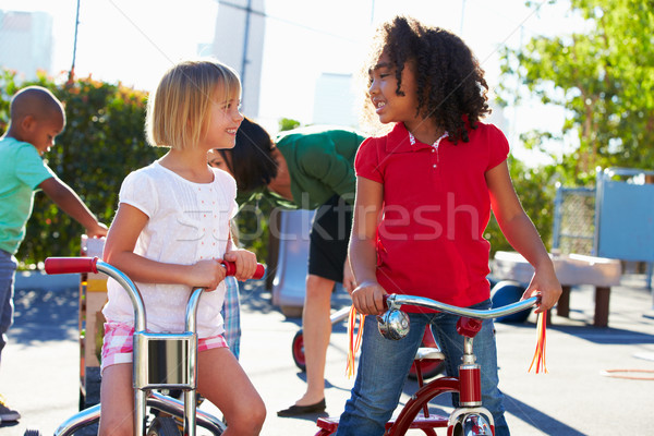 Twee meisjes paardrijden speeltuin meisje gelukkig Stockfoto © monkey_business