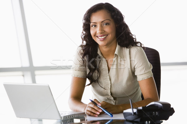 Businesswoman working at desk Stock photo © monkey_business