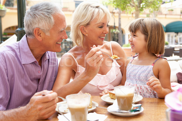 Grandparents With Granddaughter Enjoying Coffee And Cake In Caf Stock photo © monkey_business