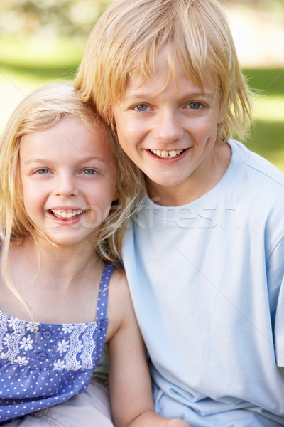 Brother and sister pose in a park Stock photo © monkey_business
