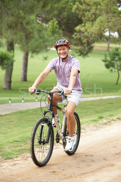 ストックフォト: シニア · 男 · 自転車 · 公園 · 幸せ