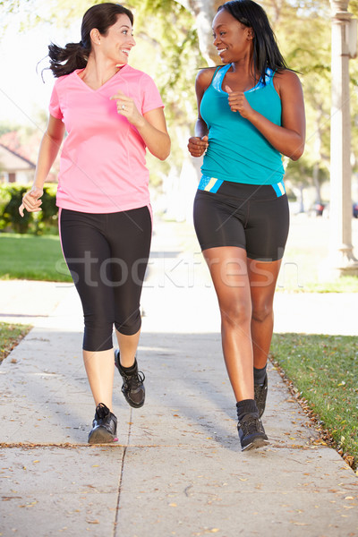 Due femminile runners suburbana strada Foto d'archivio © monkey_business