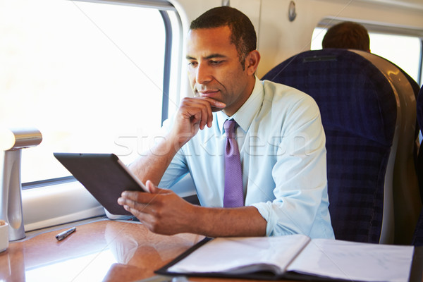 Biznesmen pociągu cyfrowe tabletka technologii Zdjęcia stock © monkey_business