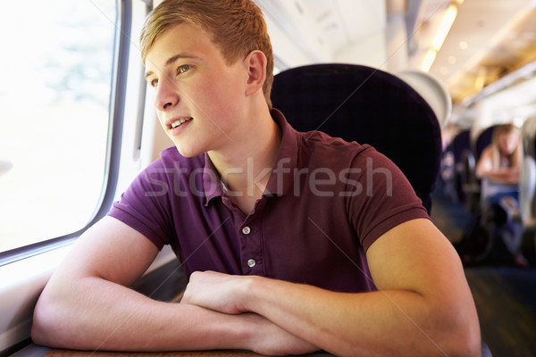 Tânăr relaxare tren călătorie fericit bărbaţi Imagine de stoc © monkey_business