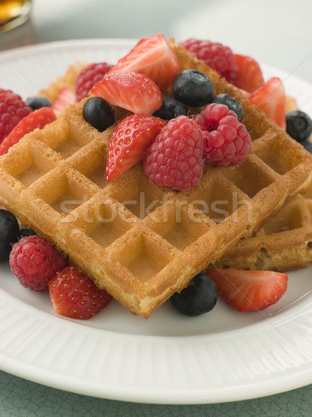 Plate Of Waffles With Berries And Maple Syrup Stock photo © monkey_business