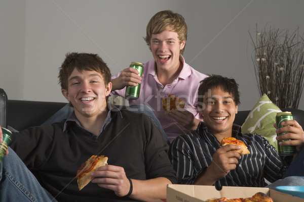 Tinédzser fiúk eszik pizza otthon csoport társalgó Stock fotó © monkey_business