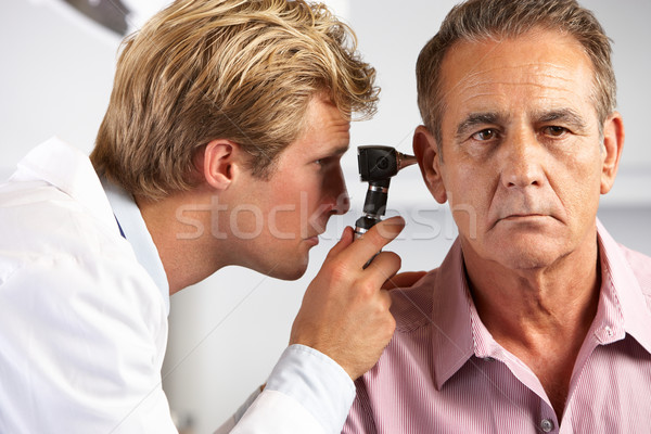Orvos megvizsgál férfi fülek férfiak dolgozik Stock fotó © monkey_business