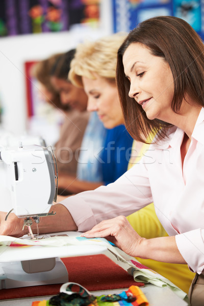 Group Of Women Using Electric Sewing Machines In class Stock photo © monkey_business