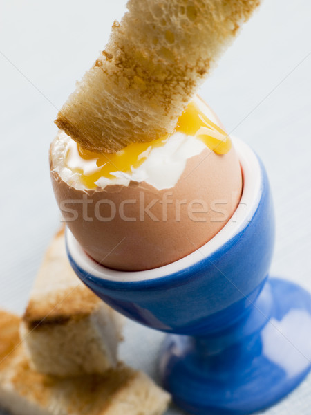 Toasted Soldier being Dipped into a Soft Boiled Egg Yolk Stock photo © monkey_business