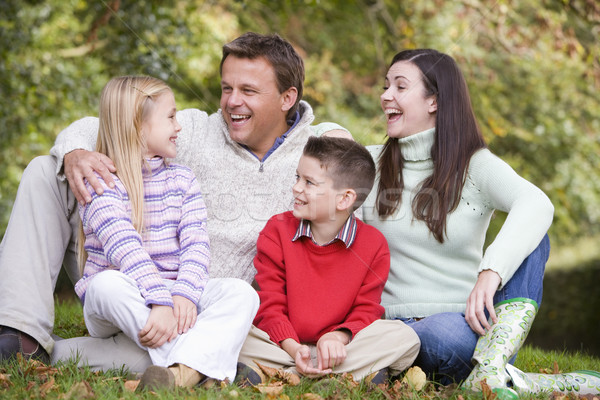 Family relaxing in autumn woodlands Stock photo © monkey_business