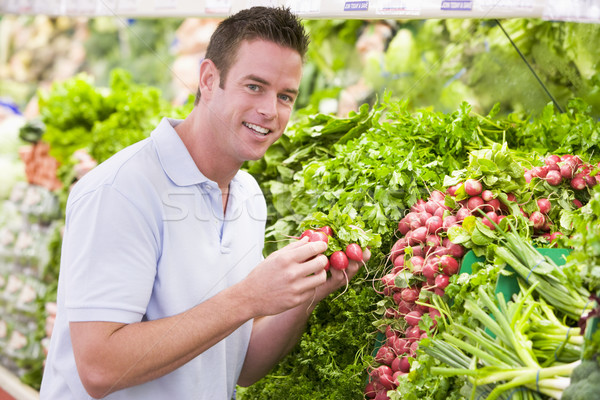 Young man shopping for fresh produce Stock photo © monkey_business