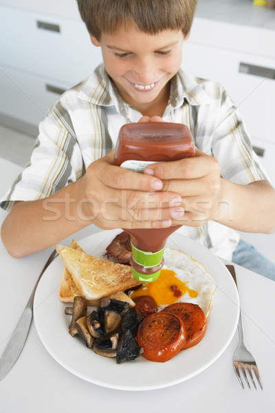 Young Boy Eating Unhealthy Fried Breakfast Stock photo © monkey_business