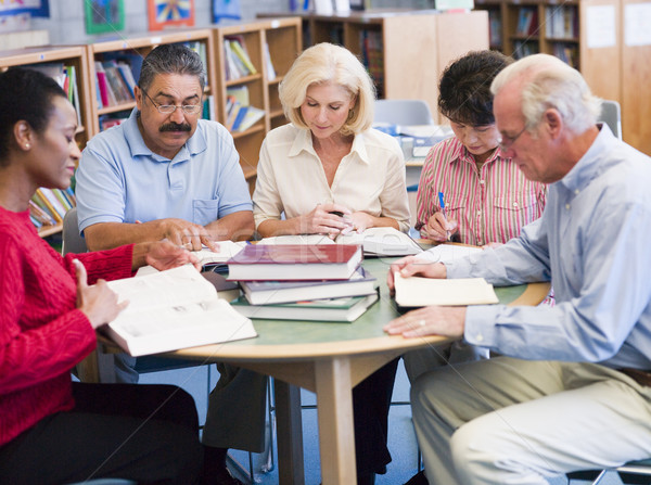 Stock photo: Mature students studying in a library