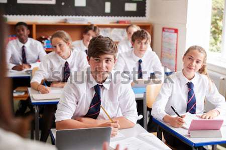Schoolchildren practicing on a keyboard in music class Stock photo © monkey_business