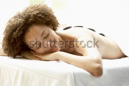 Young Woman Enjoying Hot Stone Treatment Stock photo © monkey_business